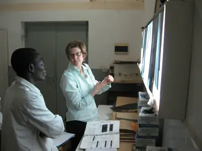 MAP Team member, Captain Mary Naughton, reviews chest x-rays with a panel physician in Ghana