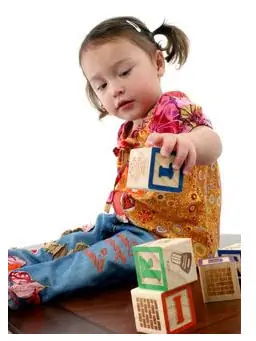 Photo: Child playing with blocks Photo: Child playing with blocks