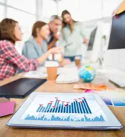 people meeting with tablet on conference room table