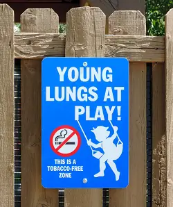 no smoking sign reading