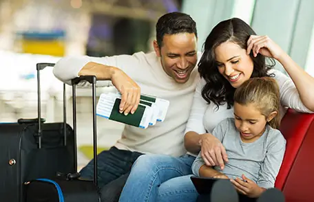 Family of three in an airport waiting Family of three in an airport waiting